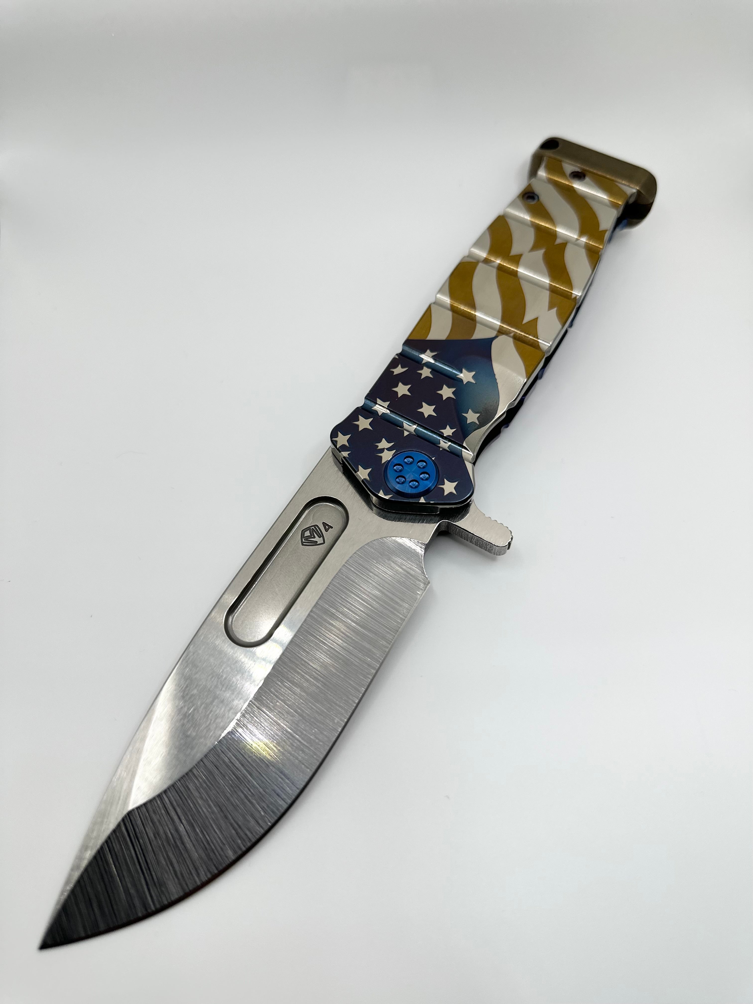Medford Knife USMC Fighter Flipper S45VN Tumbled Blade, Tumbled Billowing Flag Handle, Blue Spring & HW, Bronze Clip & Pommel - Tristar Edge