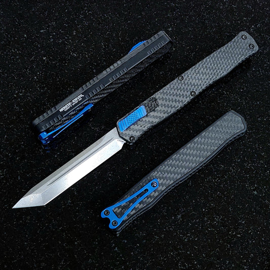 Heretic Knives Cleric II Carbon Fiber top/CF Inlay, Stonewash Tanto, black hardware, and Blue Ti Clip and Button - Tristar Edge