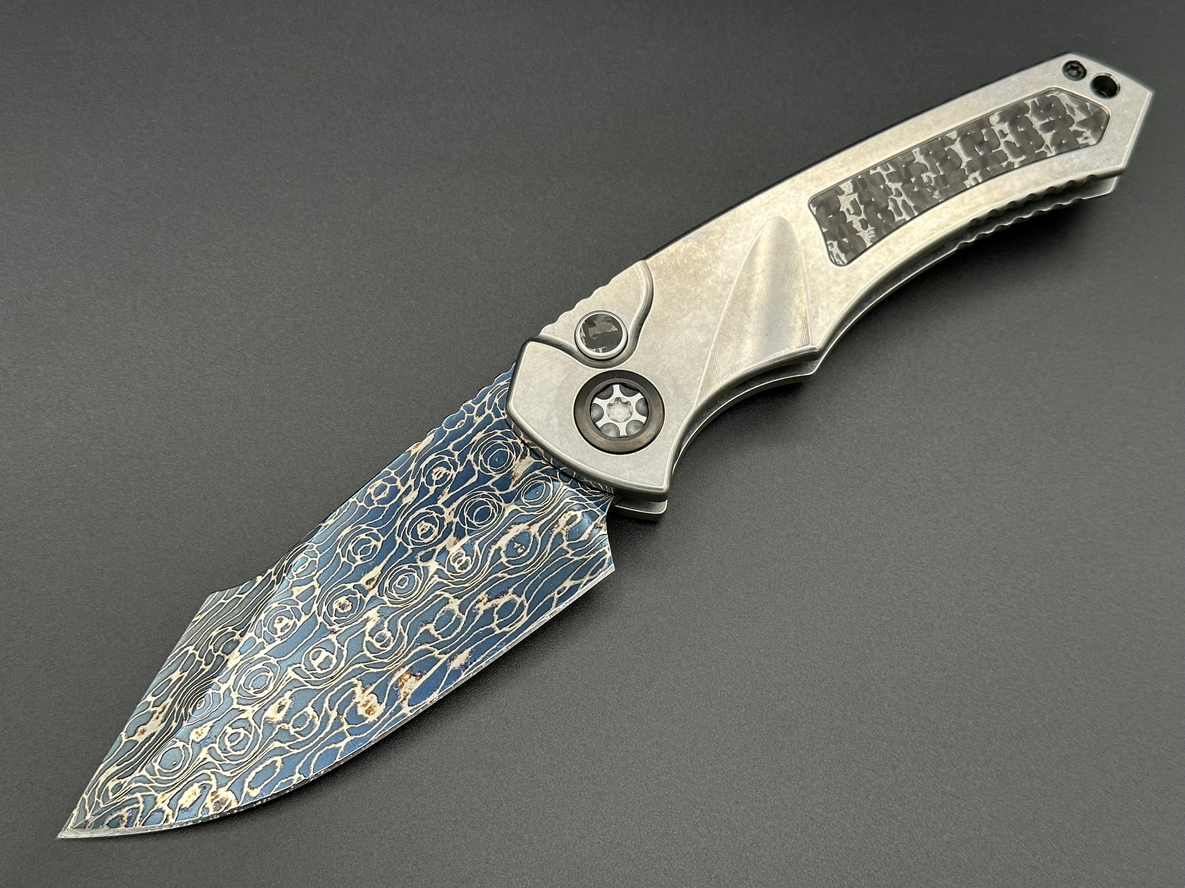 Heretic Knives Pariah Auto Titanium and Baker Forge Silver Snakeskin Inlay w/ Blued VF Damascus SE - Tristar Edge