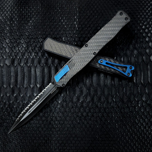 Pre-Order: Heretic Knives Cleric II Carbon Fiber top/CF Inlay, DLC Double Edge Full Serrated , black hardware, and Blue Ti Clip and Button - Tristar Edge