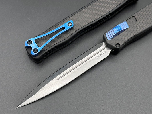 Heretic Knives Cleric II Carbon Fiber top/CF Inlay, Stonewash Double Edge, black hardware, and Blue Ti Clip and Button - Tristar Edge
