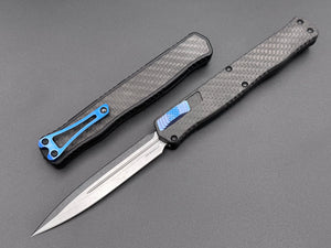 Heretic Knives Cleric II Carbon Fiber top/CF Inlay, Stonewash Double Edge, black hardware, and Blue Ti Clip and Button - Tristar Edge