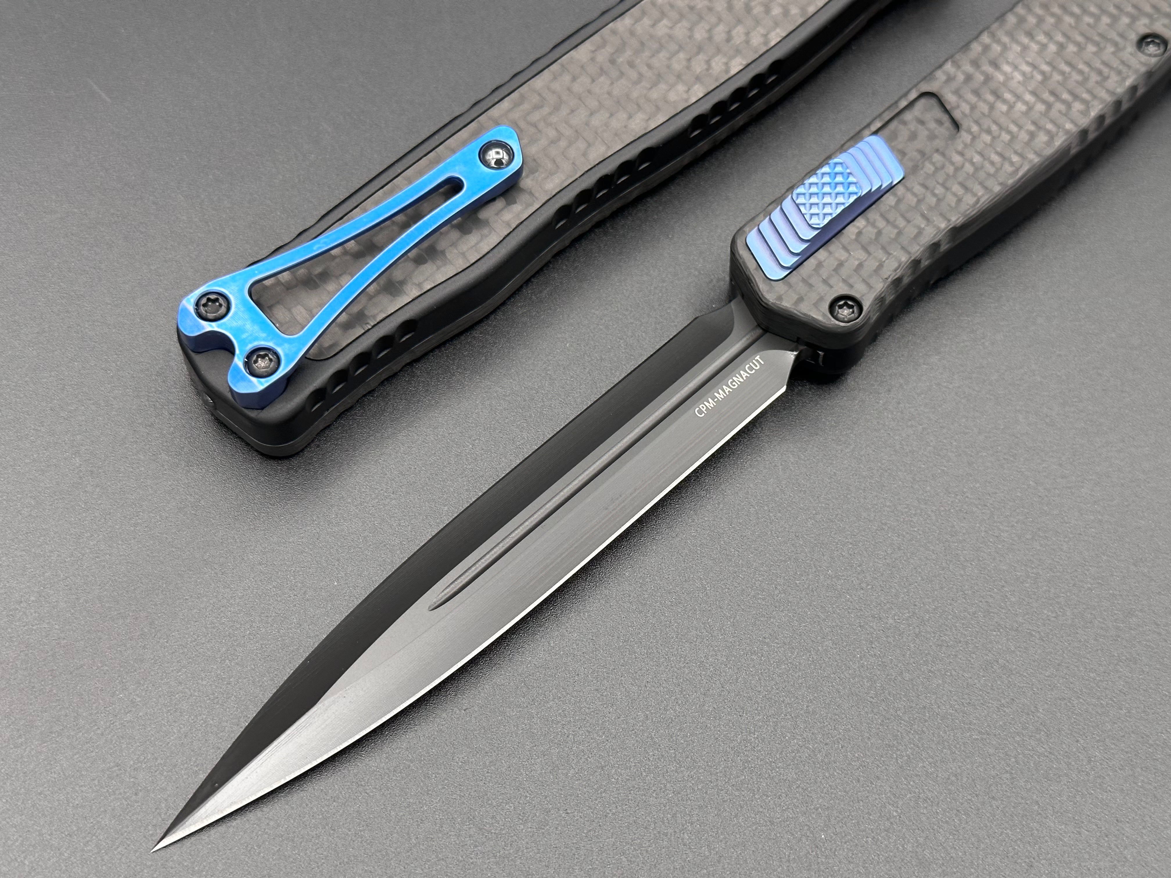 Heretic Knives Cleric II Carbon Fiber top/CF Inlay, DLC Double Edge, black hardware, and Blue Ti Clip and Button - Tristar Edge